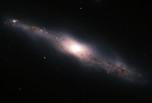 Spiral galaxy NGC 7582, brightest in Grus Quartet, shows dust lanes and star formation regions (near-infrared image).