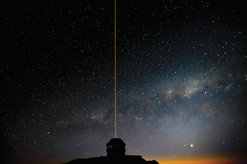 The Gemini South GeMS laser propagates into the night sky as the Milky Way rises during GeMS/GSAOI System Verification observations.