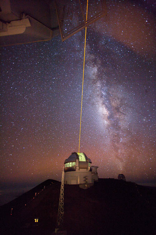 Picture of the Gemini North Laser Guide Star propagation as seen from the Canada-France-Hawai‘i telescope with the Milky Way overhead.