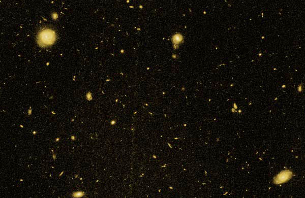Image from Hubble Space Telescope showing a portion of a field containing GDDS galaxies. The larger, brighter galaxies in the foreground are not part of the GDDS survey. The faint, smaller galaxies scattered throughout the image are likely to be GDDS galaxies.