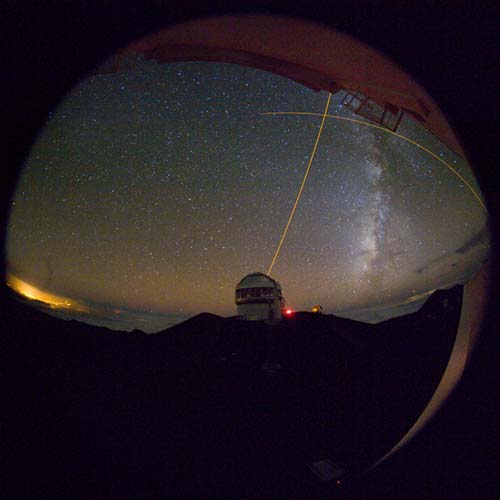 Picture of the Gemini North telescope during a laser guide star test.