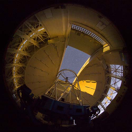 Picture of the inside of the Gemini North dome illuminated by the setting full Moon.