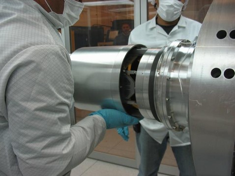 Photo of the engineers inspecting the instrument.