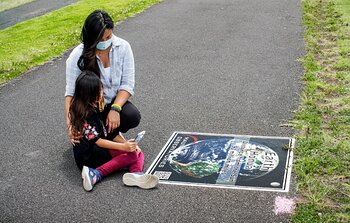 Mother and child participate in the Waimea Solar System walk