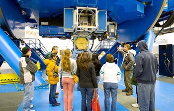 Staff family tour participants visit the telescope