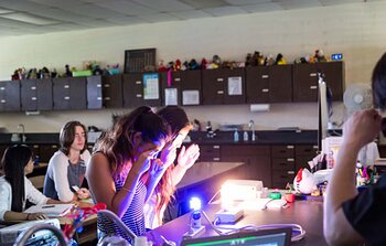 Students observing light colors during Journey