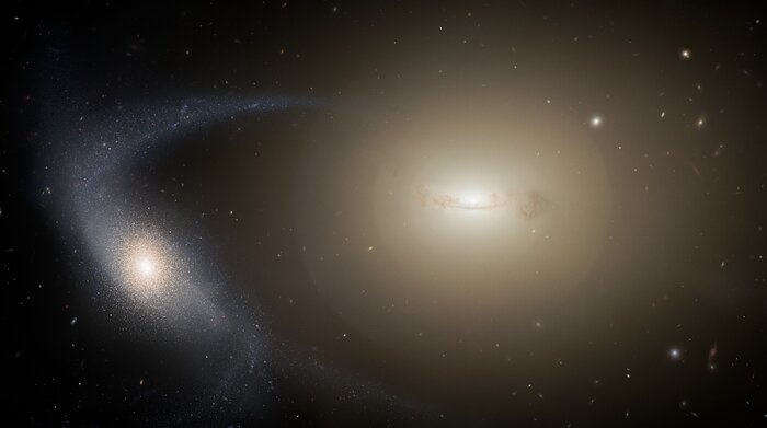 Artist’s impression of a dwarf galaxy undergoing tidal stripping