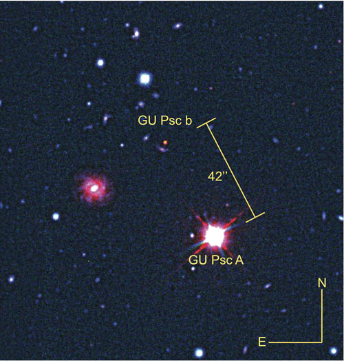Composite image of a star (GU Psc) and its companion planet (GU Psc b). The image combines visible and infrared light from Gemini South telescope and an infrared image from CFHT.