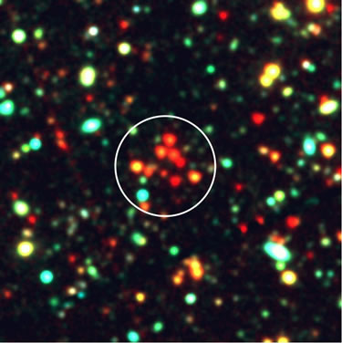 Color composite image (100" x 100") of the newly discovered cluster. This figure illustrates the compact clustering of very red galaxies in the vicinity of GDDS-12-5869.